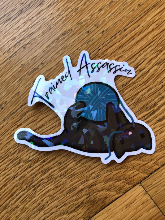 Cat With Yarn "Trained Assassin" Holographic Vinyl Sticker